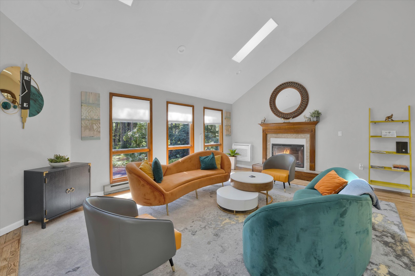 Sink into luxurious velvet seating under grand vaulted ceilings, warmed by a cozy modern fireplace and bright natural light.