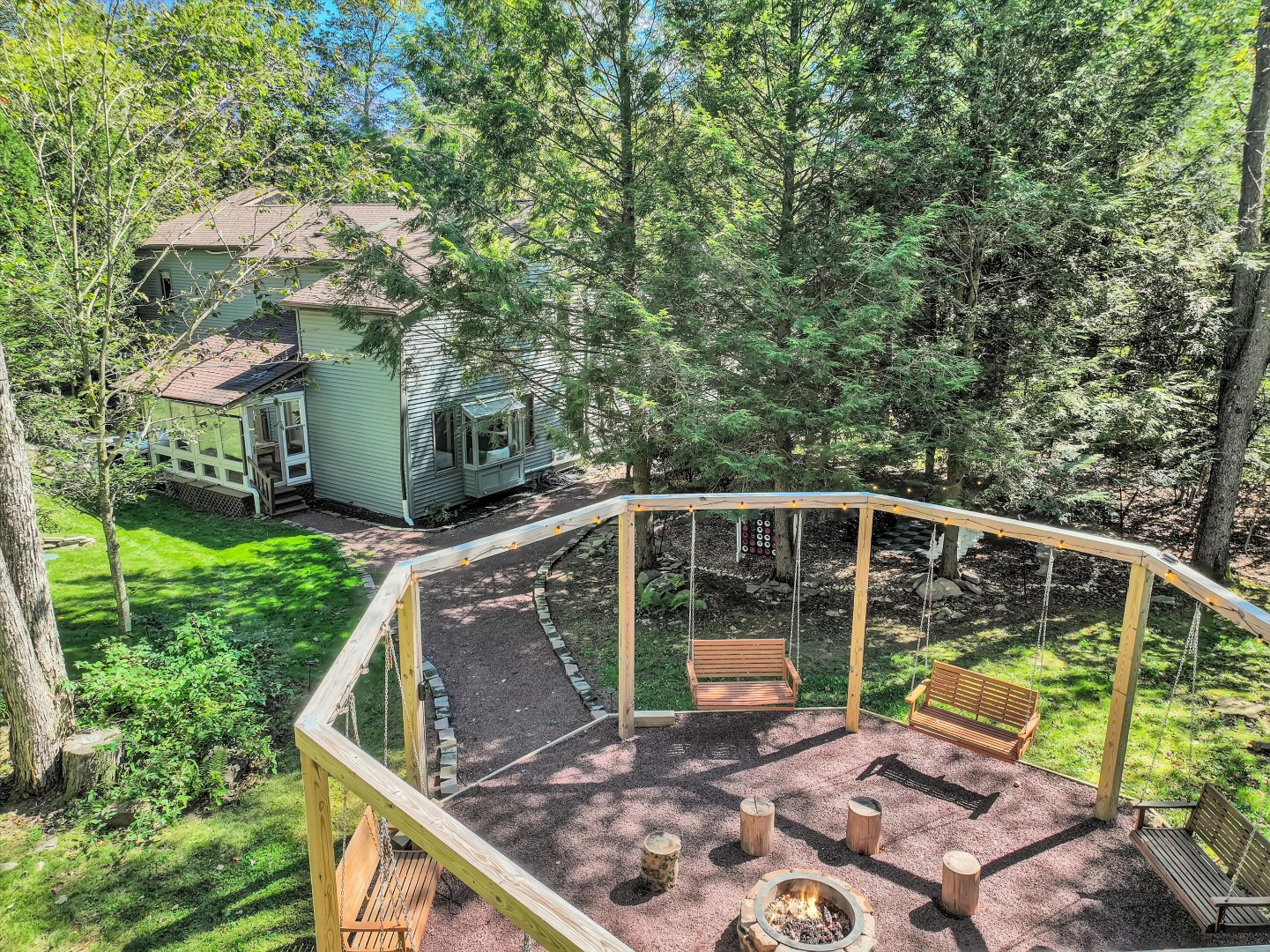 Gather around the cozy fire pit and sway gently on the inviting swings under the open sky, sharing stories and laughter with loved ones.